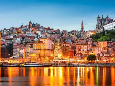 a cityscape of a city with a river and buildings at 1-bedroom apartment in Porto's heart in Porto