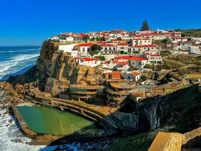 a village on a cliff next to the ocean at Cozy and modern apartment in Porto in Porto