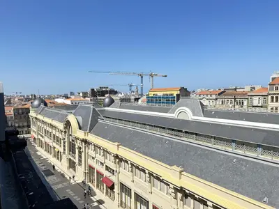 a view of a building with a train station at Charming Modern Studio in Porto in Porto