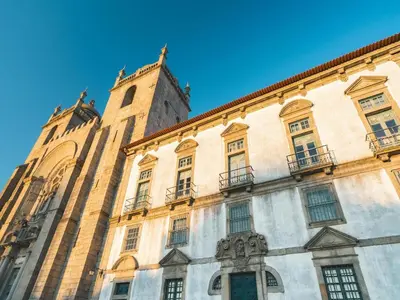a tall building with windows and a clock tower at Charming Modern Studio in Porto in Porto