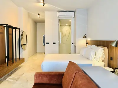 a hotel room with two beds and a couch at Charming urban apartment in Porto's heart in Porto