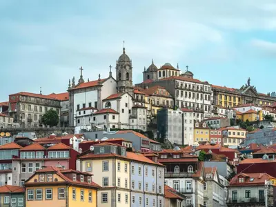 a group of buildings on top of a hill at Charming urban apartment in Porto's heart in Porto