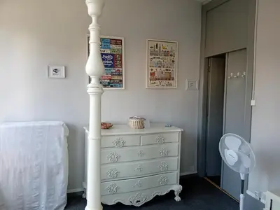 a bedroom with a white bed with two lamps at Charming House Quental in Porto