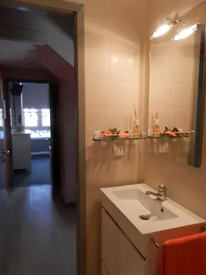 a bathroom with a sink and a mirror at Charming House Quental in Porto