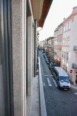 a view of a street from a window of a building at Central with balcony - 9 min-walk to Trindade in Porto