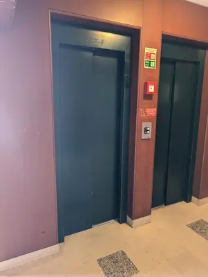 a row of elevator doors in a building at Downtown Studio 80 meters to metro and Free Parking in Porto