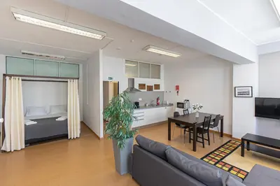 a living room with a couch and a dining room at Oporto Spacious apartment in Porto