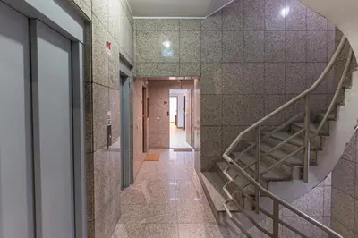 a hallway with a staircase in a building at Oporto Spacious apartment in Porto