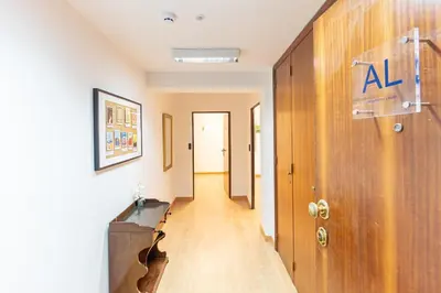 an empty hallway with a door and a hallway sidx sidx sidx at Oporto Spacious apartment in Porto