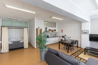 a living room with a couch and a dining room at Oporto Spacious apartment in Porto