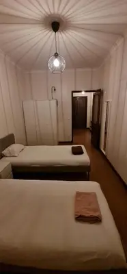 a room with two beds and a light at Catarina 711 in Porto