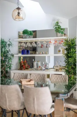 a room with chairs and shelves with plants at Casa Vista Douro in Vila Nova de Gaia