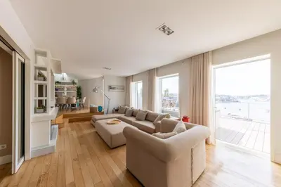 a living room with a couch and a table at Casa Vista Douro in Vila Nova de Gaia