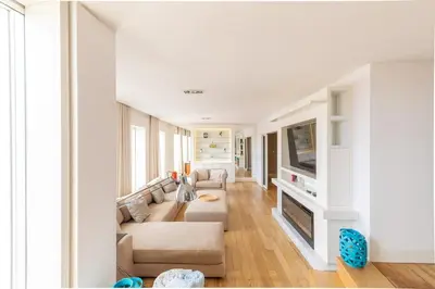 a living room with a couch and a tv at Casa Vista Douro in Vila Nova de Gaia