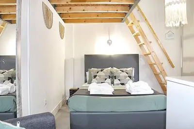 a bedroom with a bed with two towels on it at Art Quarter Oporto City Center in Porto
