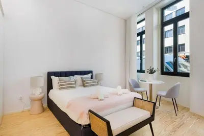 a bedroom with a bed and a table and chairs at Modern Studio in Porto Center, Ideal City Base in Porto