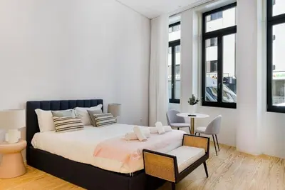 a bedroom with a bed and a table and chairs at Modern Studio in Porto Center, Ideal City Base in Porto