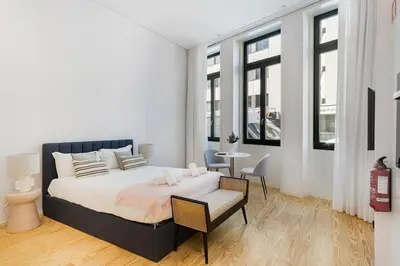a bedroom with a bed and a table and chairs at Modern Studio in Porto Center, Ideal City Base in Porto