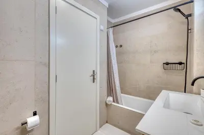 a bathroom with a sink and a shower at 700 Verde Esperança in Porto