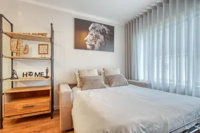 a bedroom with a bed and a large window at 700 Verde Esperança in Porto