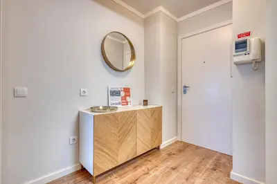 a bathroom with a vanity and a mirror at 700 Verde Esperança in Porto