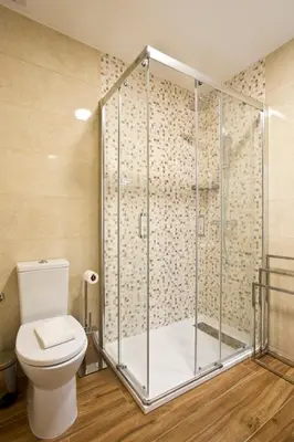 a bathroom with a toilet and a shower at Aposentus - CS Trindade Apartments in Porto