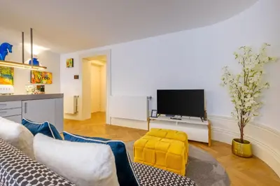 a living room with a couch and a tv at Discovery Luxury Historic House At Rua das Flores in Porto