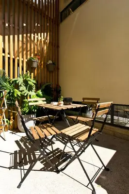a table and two chairs and a table and a table and chairs at Aposentus - Poveiros Terrace View in Porto