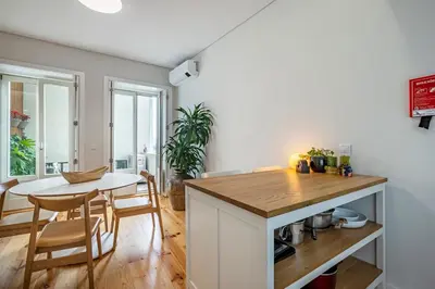 a kitchen and dining room with a table and chairs at Aposentus - Poveiros Terrace View in Porto