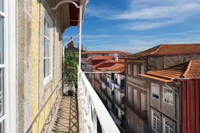 a view of a city street from a balcony at São Miguel Apartments in Porto