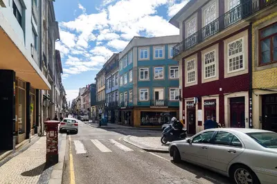 a city street with a car parked on the street at WHome Trendy Cedofeita Loft - Luxe & Light-Filled in Porto