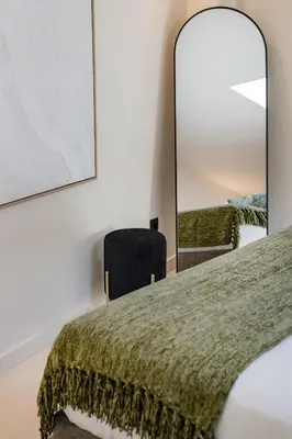 a white bedroom with a bed and a mirror at Urban Loft @ Terracotta Collection in Porto