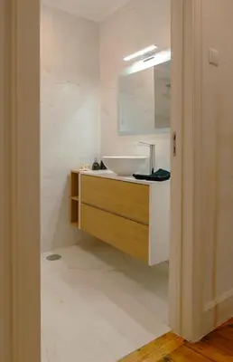 a bathroom with a sink and a mirror at The Cale - Porto, Firmeza 1 in Porto