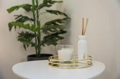 a glass of milk and a candle on a table at GuestReady - Urkunina apartment in Porto