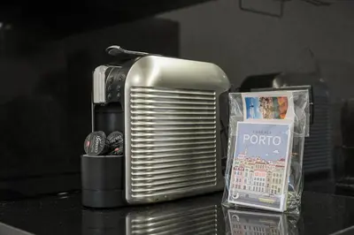 a toaster sitting on top of a table next to a box at GuestReady - Urkunina apartment in Porto