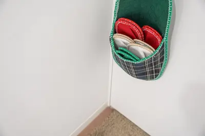 a pair of shoes in a pocket in a closet at GuestReady - Urkunina apartment in Porto