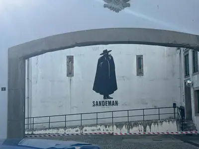 a painting of a dress on the side of a building at Riverside Studio By Luís Bridge, WOW & Half Rabbit in Vila Nova de Gaia