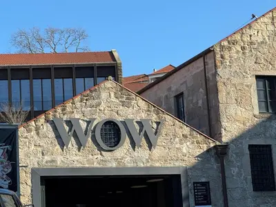 aww sign on the side of a building at Riverside Studio By Luís Bridge, WOW & Half Rabbit in Vila Nova de Gaia