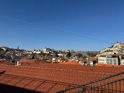 a view of a city with a red roof at Cozy Studio 2 min walk to Douro River with AC in Vila Nova de Gaia
