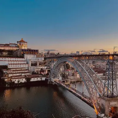 a bridge over a river with a city at 2-Studio House Steps from Best Attractions of Porto in Vila Nova de Gaia