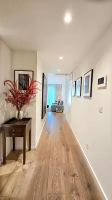 a living room with a table and a couch at Central Apartment with parking/terrace in Porto