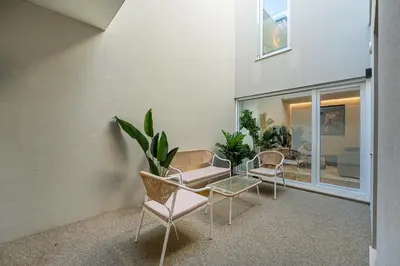 a living room with chairs and a couch at GuestReady - Vera Cruz Apartments in Porto