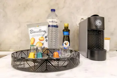 a basket with a bottle of water and some drinks at Luxury Style 7 with AC Downtown Porto near Metro in Porto