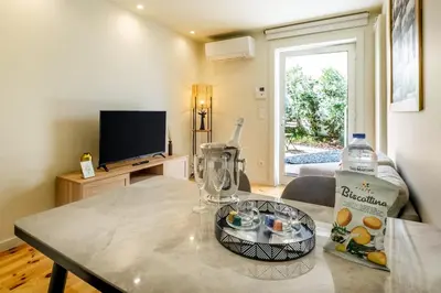 a living room with a table with a blender on it at Luxury Style 7 with AC Downtown Porto near Metro in Porto