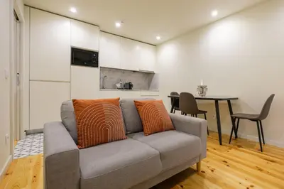 a living room with a couch and a table at Luxury Style 6 with AC Downtown Porto near Metro in Porto