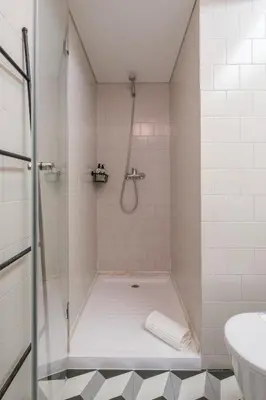 a bathroom with a shower and a sink at Cedofeita Sunshine Luxury Apartment Downtown Porto in Porto