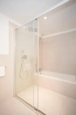 a glass shower in a bathroom with a tub at Liiiving in Porto - Modern & Glam Apartment J in Porto