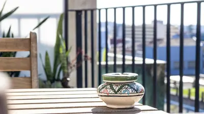 a vase sitting on top of a wooden table at Stylish Duplex with Balcony in Porto by LovelyStay in Porto