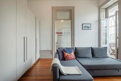 a living room with a couch and a table at Palazzo Alvares Cabral in Porto