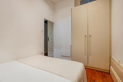 a bathroom with a toilet and a sink and a shower at Palazzo Alvares Cabral in Porto